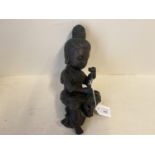 Bronze seated Buddha holding a plant, 27cmLong