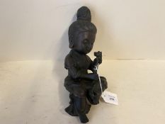 Bronze seated Buddha holding a plant, 27cmLong