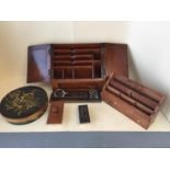 Hardwood stationery cabinet, a desk tidy, a tooled and gilt leather pen try and inkwell, a painted