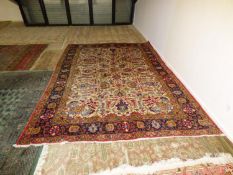 Traditional Old Persian carpet, oatmeal ground central panel with all over stylised floral pattern