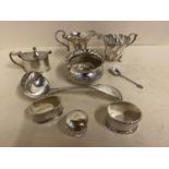 9 small Hallmarked silver cabinet pieces including 2 cream jugs, ladle, spoon, napkin rings, mustard