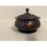 Gold splash bronze circular incense burner with pierced lid seal marks to base 10cm diameter