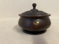 Gold splash bronze circular incense burner with pierced lid seal marks to base 10cm diameter