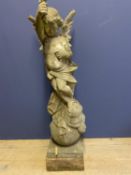 Weathered marble statue of a winged cherub on a ball, 104 cmH. Condition - some damage. Please note,
