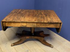 Regency Rosewood sofa table on a quadram base with brass lion paw feet with a drawer to either