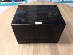 A good quality coromandel wood fitted travelling vanity case with rising lid, labelled James