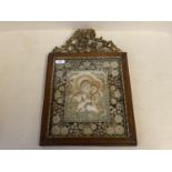 A rare Icon of "Madonna and Child" in possibly a ceramic and relief within a frame of tiny