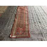 Old Persian runner terracotta ground with central panel and multi border 300 x 77 wear to central
