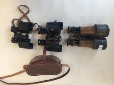 Quantity of vintage binoculars, worn
