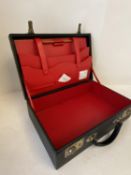 Black attaché case, with red fitted interior
