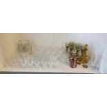 Qty of glass wear to include decanters, cut glass drinking stemmed glasses, tumblers, coloured glass