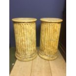 Pair of painted wooden pedestal columns, 61cmH and a single column