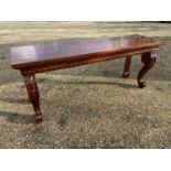 Good George III heavy figure mahogany oblong console serving table, with a carved under frieze on