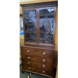 A regency mahogany Secretaire Bookcase, the top astragal glazing, and drawer opening to reveal