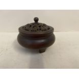 Bronze incense burner with pierced lid, decorated with bats, on 3 feet, seal marks to base, 9cmDiam