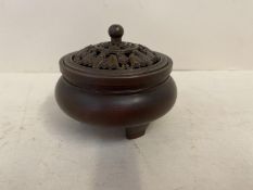 Bronze incense burner with pierced lid, decorated with bats, on 3 feet, seal marks to base, 9cmDiam