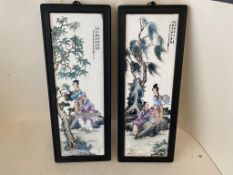 Pair of Chinese ceramic oblong plaques, 49 x 16cm