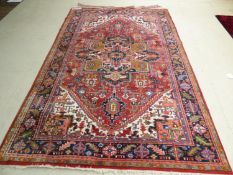 Large Persian rug with 4 center medallions & blue border 207x295cm