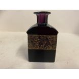 A Moser purple shouldered bottle, the body decorated with figures in relief, signature to base,
