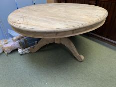 Good quality bleached hardwood circular table on a central pedestal. 151 cm diameter. (Condition -