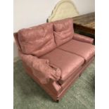 Pink 2 seater sofa. wear and staining