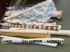 Rolls of surplus fabric, to include Colefax, Andrew Martin, approx 15 rolls.