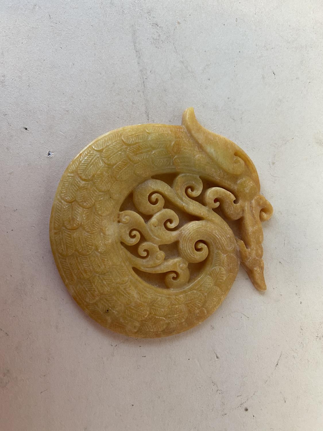 Beautifully carved natural Jade Amulet , in the form of a mythical dragon 8cm