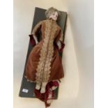Vintage doll - porcelain head, leather legs, and period dress (condition - some general wear - see