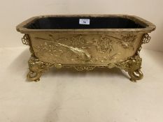 Good gilded bronze oblong jardiniere, with relief decoration of exotic birds, the 4 feet of mythical