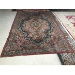 Old traditional blue ground woollen rug with all over red and fawn stylised pattern 285 x 197