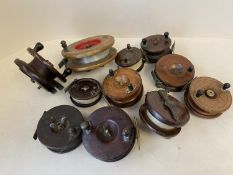 Collection of 10 vintage wooden fishing reels and a bakelite reel Allcock Aerialite, (11 in