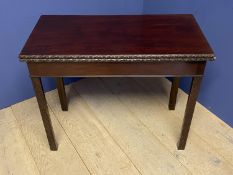 C18th Irish red walnut Chippendale style foldover tea table with blind fretwork carvings to legs
