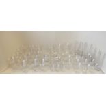 Quantity of stemmed cut glass, including fine etched pattern wine glasses and 8 glass bowls (