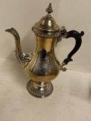 Hallmarked silver coffee pot with fluted foot and lid with acanthus spout, 30cmH, crest engraved,