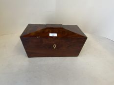 Figured mahogany tea caddy with lion mask ring handles and fitted interior with glass mixing bowl.