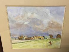 Folio of unframed watercolours and prints including countryside and seaside scenes