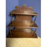 Georgian mahogany three tiered wall hanging shelf supported by slender carved supports and carved