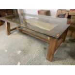 A very good quality, solid oak dining table, with glass top. The heavy oak frame consisting of A