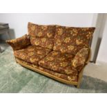 ERCOL sofa with orange cushions, 204cmW x 85cmD x 94cm H, and a red upholstered wing chair and a