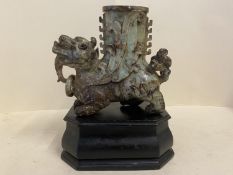 Chinese hardstone mythical beast vase on a wooden stand 17 high. Condition General wear to the stand