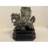 Chinese hardstone mythical beast vase on a wooden stand 17 high. Condition General wear to the stand