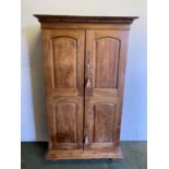 A good quality, heavy, Continental teak cupboard, opening to reveal shelves178cmH x 106cm W x 47cmD