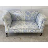 Edwardian double drop end small sofa, upholstered in blue and white fabric, condition - faded/