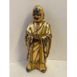 A Chinese gilt bronze figure of a standing monk 10 cm H