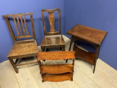 Two oak solid seat hall chairs, a mahogany hanging shelf, and a mahogany swivel top games table,
