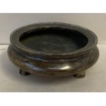 A Chinese circular bronze shallow censer on 3 feet and seal mark to base 9.5 cm dia 506gms