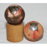 Presentation cricket balls. Two balls, each with inscribed silver hallmarked shields attached.