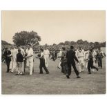 England v West Indies 1957. Original mono press photograph of young supporters running on to the