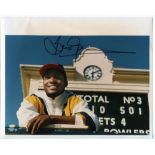 Brian Lara 1995. Colour press photograph of Lara standing in front of the scoreboard having made his