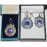 Silver cricket medals. Three silver cricket medals with blue enamel decoration, each awarded to